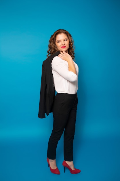 Business woman in black suit and white shirt