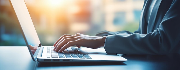 Business woman hands typing on laptop computer