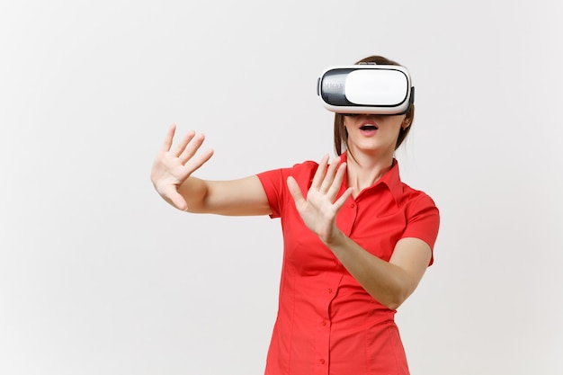 Business woman in headset of virtual reality on head touch something like push on button or pointing at floating virtual screen isolated on white background. Education future in high school concept.