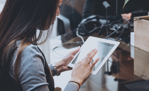 Business woman hold a tablet at the hands.