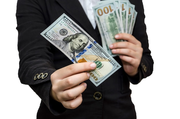 business woman holding dollar banknotes in her hands