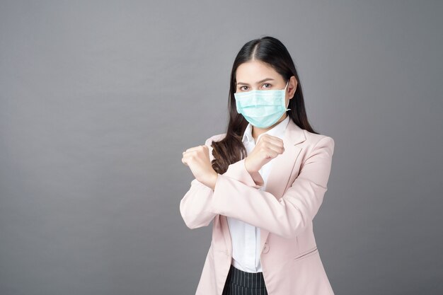 Business woman is wearing surgical mask , business protection concept