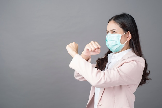 Business woman is wearing surgical mask , business protection concept