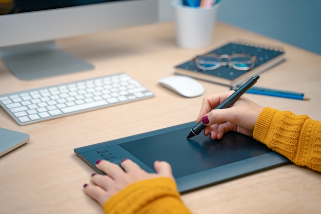 Business woman at morning at a creative studio Graphic design mock up screens