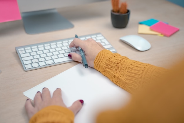 Business woman at morning at a creative studio Graphic design mock up screens