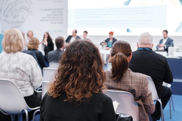 Business woman and people Listening on The Conference Horizontal Image