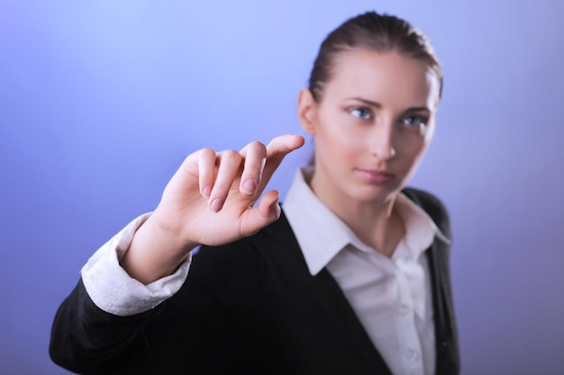 Business woman pointing finger Isolated on gay background