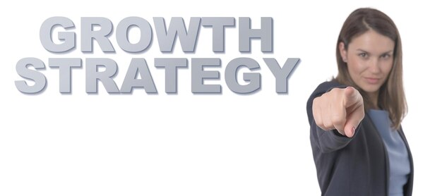 Business Woman pointing the text GROWTH STRATEGY CONCEPT Business Concept