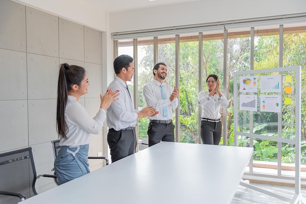 Business woman presentation plan marketing or project in future in meeting room and team applauded