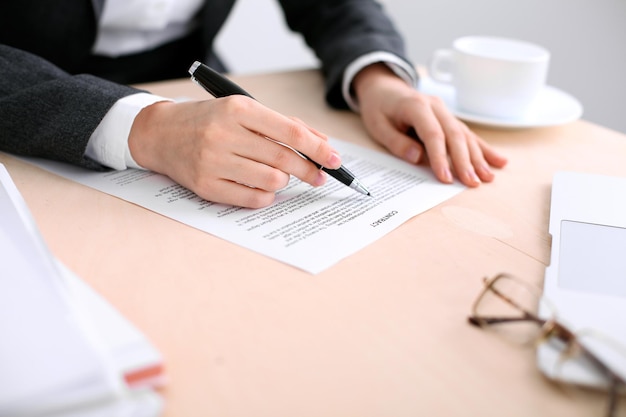 Business woman ready to sign a contract.