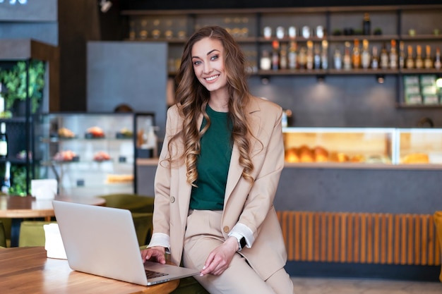 Business Woman Restaurant Owner Use Laptop