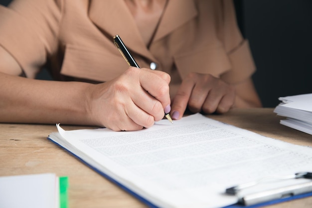 Business woman signing contract document