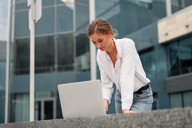 Business woman successful woman business person outdoor with cell laptop