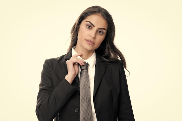 Business woman in suit and tie Confident female entrepreneur Businesswoman correct necktie prepare for business meeting Portrait of attractive elegant fixing suit isolated on white background