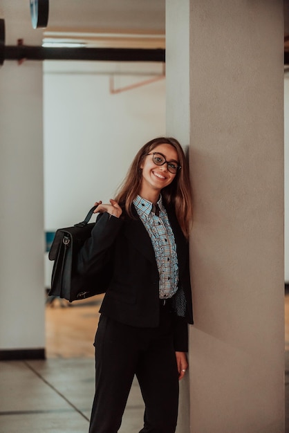 A business woman in a suit with a briefcase in her hand goes to work. Selective focus. Business concept. High quality photo