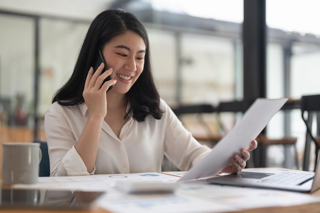 Business woman taking call for financial accounting consult