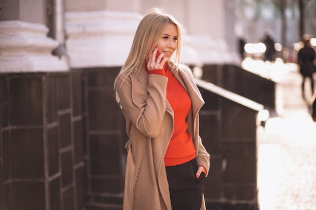 Business woman talking on the phone in the street