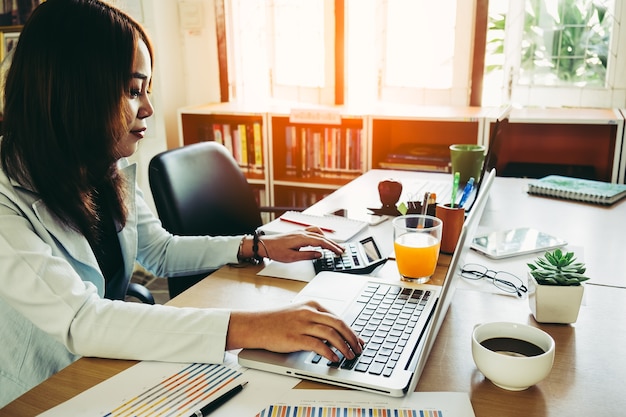 Business woman using laptop computer.