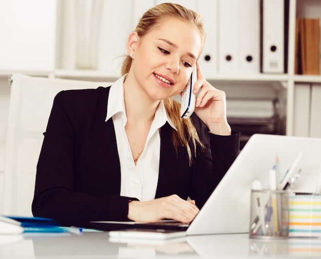 Business woman using phone