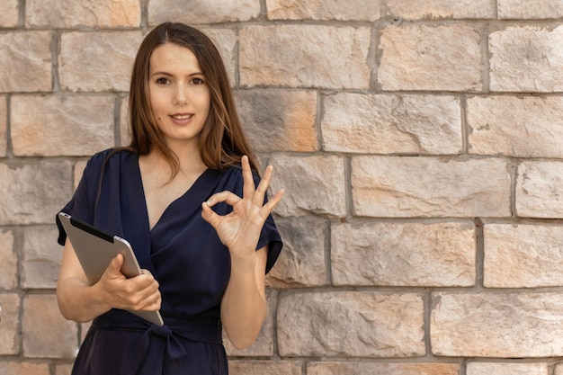 Business woman using a tablet computer Confident manager worker