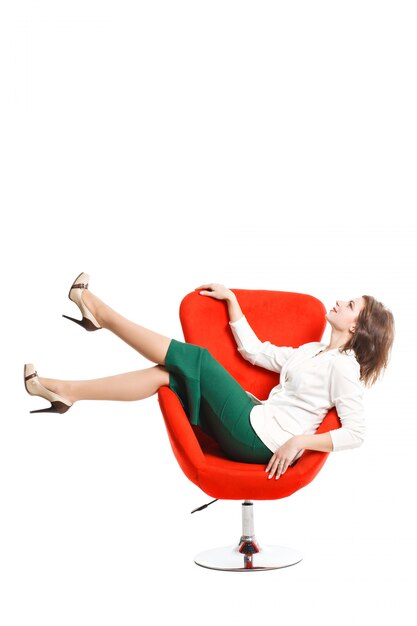 Business woman in a white blouse and green skirt resting