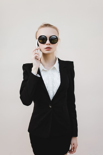 Business woman with black sunglasses