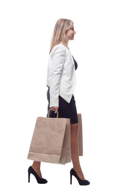 Business woman with shopping bags looking at a white blank screen