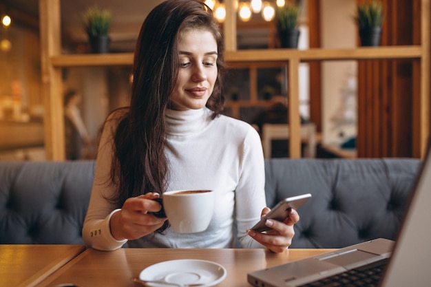 Business woman working in a cafe