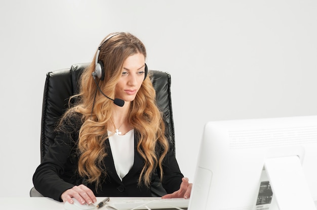 business woman working in the office using with headset