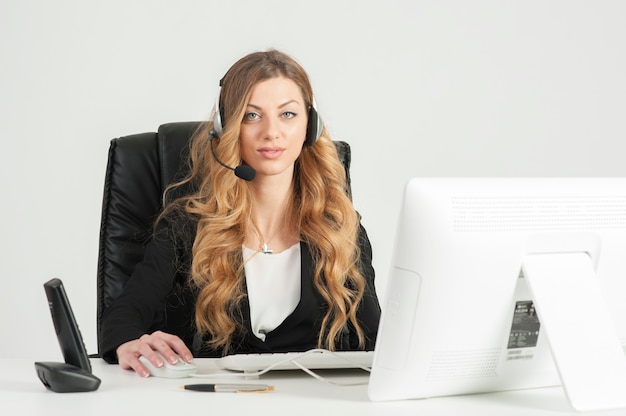 business woman working in the office using with headset