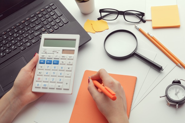 Photo business woman working with financial data hand using calculator