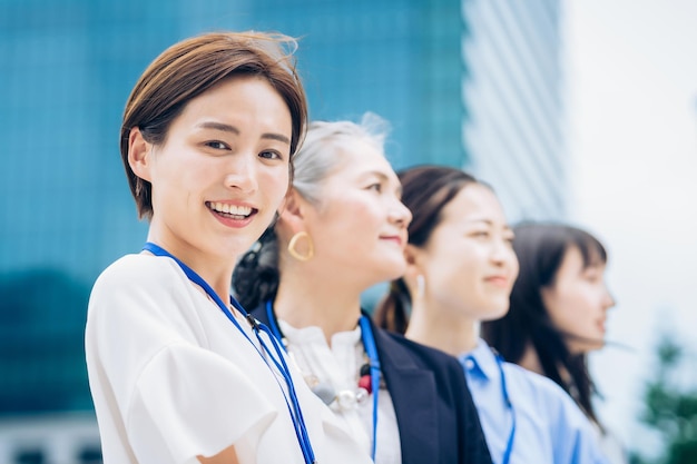 Business women lined up outdoors