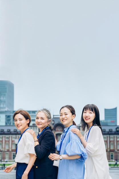 Business women lined up with smiles