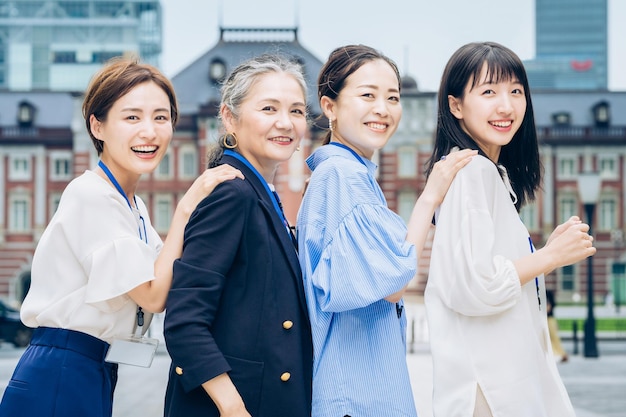 Business women lined up with smiles