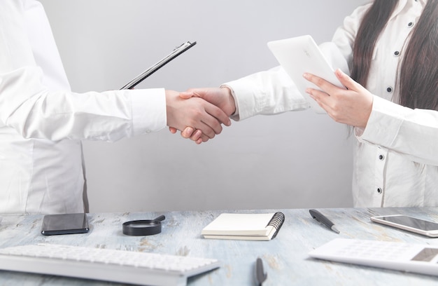 Business workers shaking hands at the office.