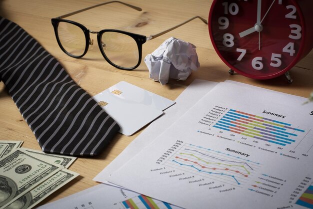 Photo business workplace with paper chartgraph and money business finance concept