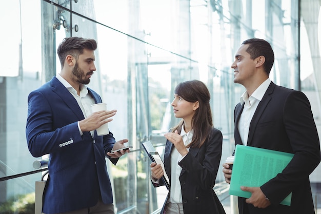 Businesses executives interacting with each other outside platform