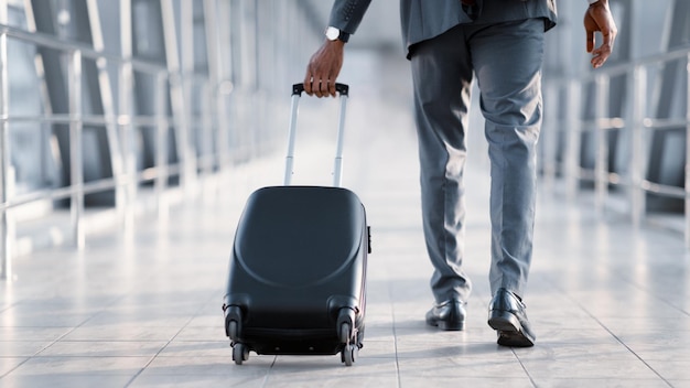 Businessman At Airport Moving To Terminal Gate For Business Trip