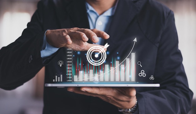 businessman analyzing forex trading graph financial data from tablet business finance technology