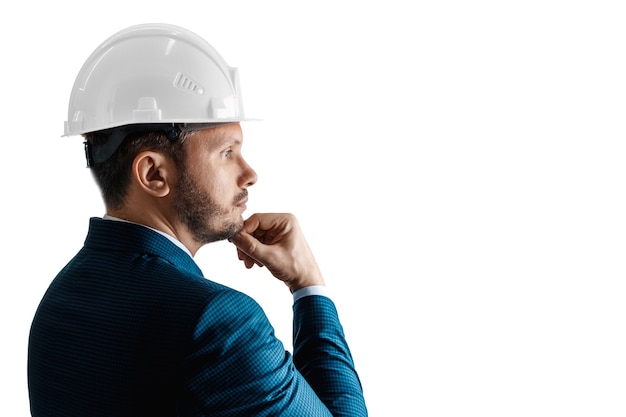 Businessman architect with a white helmet on his head