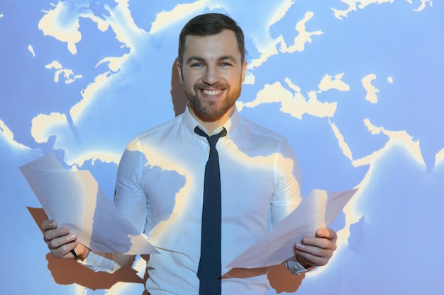 Businessman on the background of the world map international economy