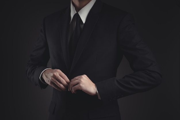 businessman in black suit on black