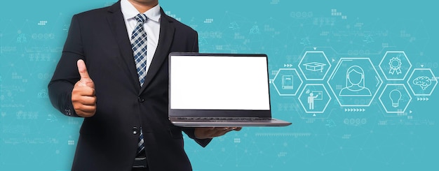 Businessman in black suit holding laptop and thumbs up virtual screen on blue background elearning education Internet Technology Webinar Online Courses concept