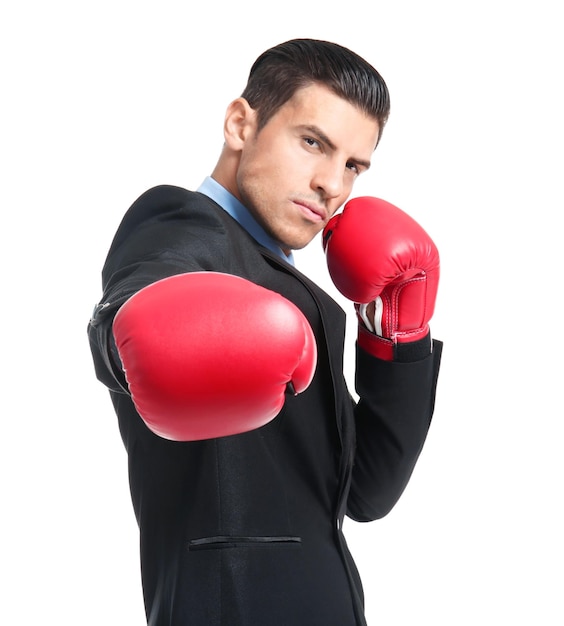 Businessman in boxing gloves on white background