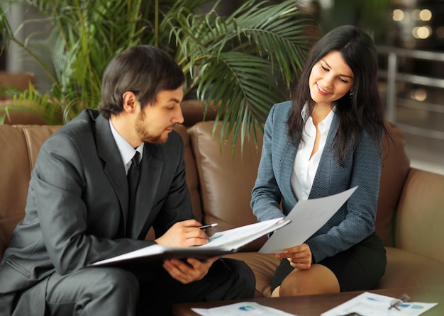 Businessman And Businesswoman Meeting In Modern Office