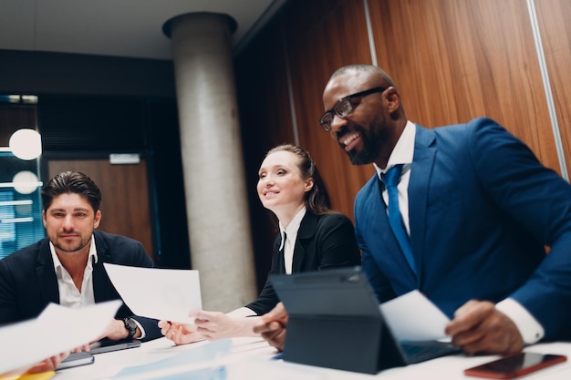 Businessman and businesswoman team at office meeting Business people group conference discussion sit at table with boss man and woman