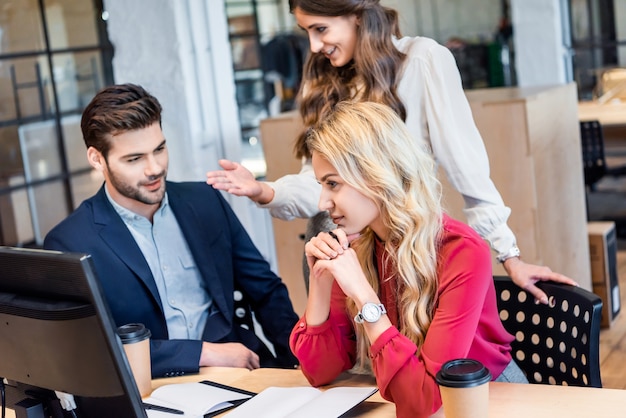 Businessman and businesswomen working on business idea together in office