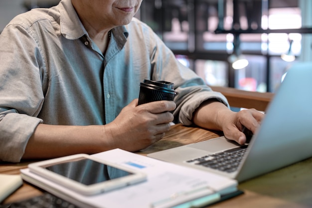 Businessman in casual style working with graph chart