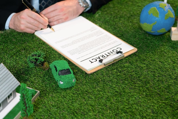 Photo businessman or ceo in office signing environmental regulation agreement to save earth with sustainable energy utilization and co2 reduction for greener future quaint