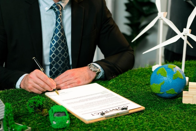 Businessman or CEO in office signing environmental regulation. Quaint